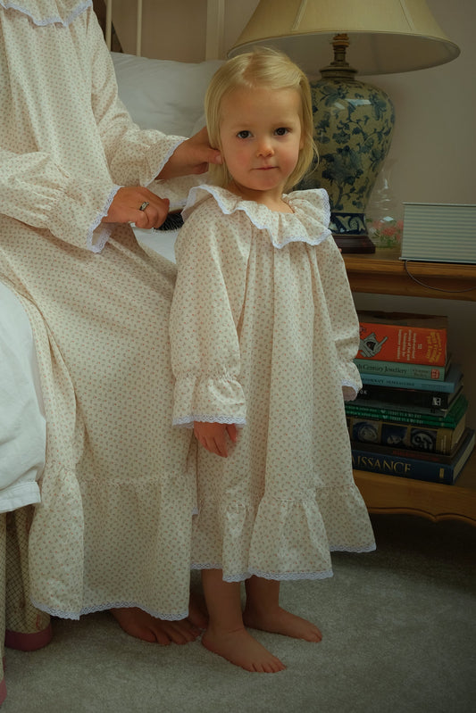 Mother and daughter in matching Harriet Jane London Briar Rose nighties, French pink floral cotton with lace trim collar, bedtime routine