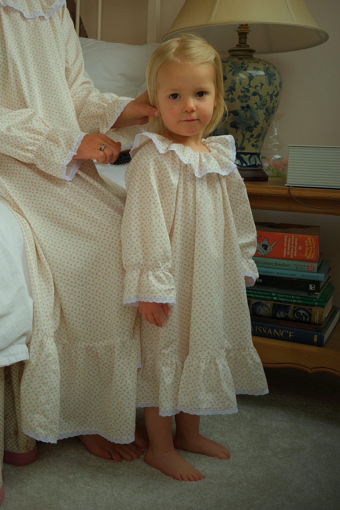 Mother and daughter in matching Harriet Jane London Briar Rose nighties, French pink floral cotton with lace trim collar, bedtime routine